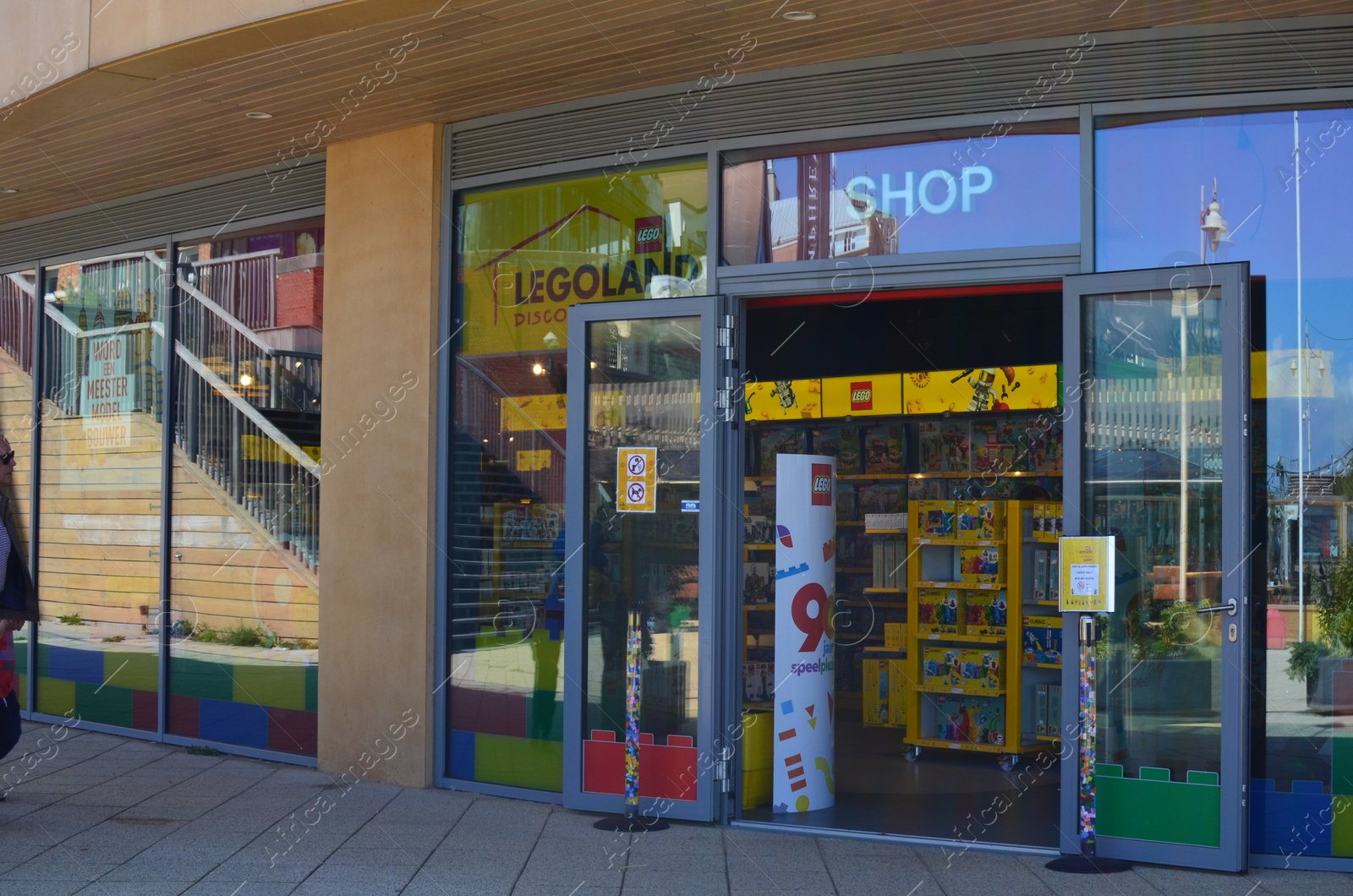 Photo of AMSTERDAM, NETHERLANDS - SEPTEMBER 10, 2022: Entrance to Lego store on city street