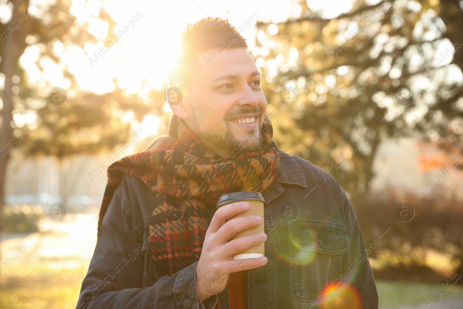 Photo of Man with cup of coffee in morning outdoors