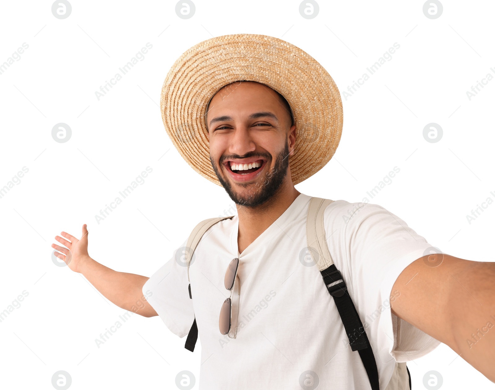 Photo of Smiling young man in straw hat taking selfie on white background