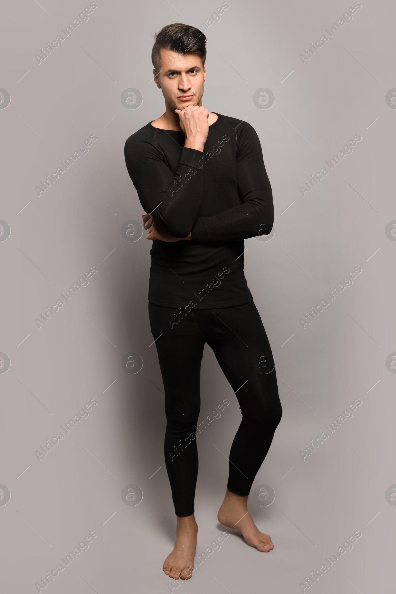 Photo of Man wearing thermal underwear on grey background