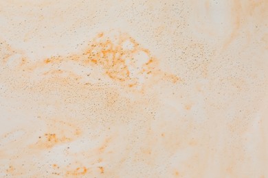 Photo of Foam after dissolving bath bomb in water, closeup