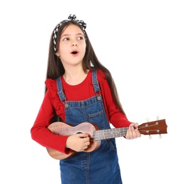 Portrait of little girl playing guitar, isolated on white