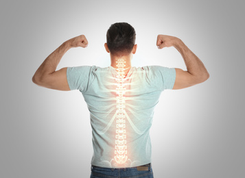 Image of Man with healthy back on light background. Spine pain prevention
