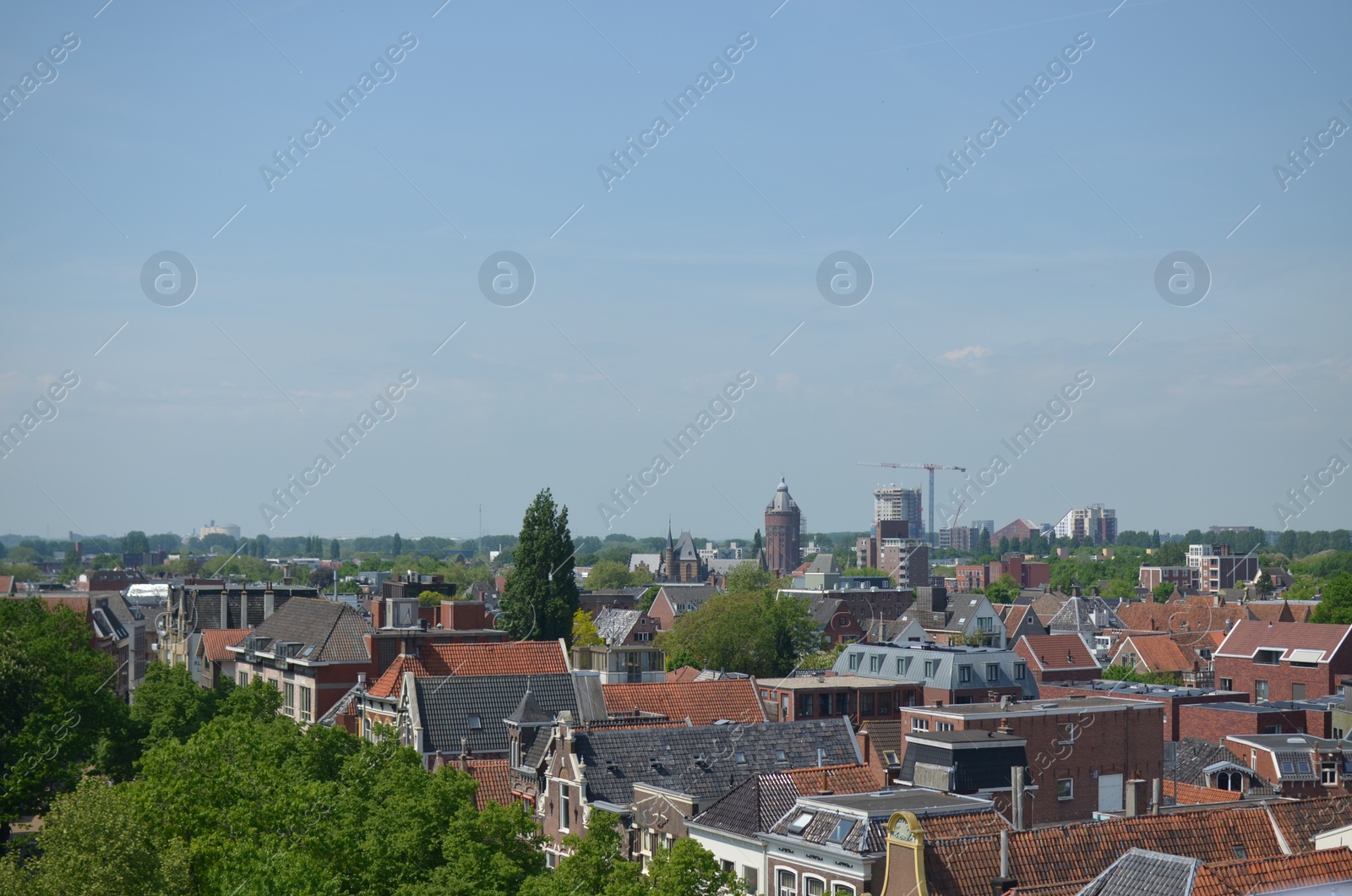 Photo of Picturesque view of city with beautiful buildings under blue sky