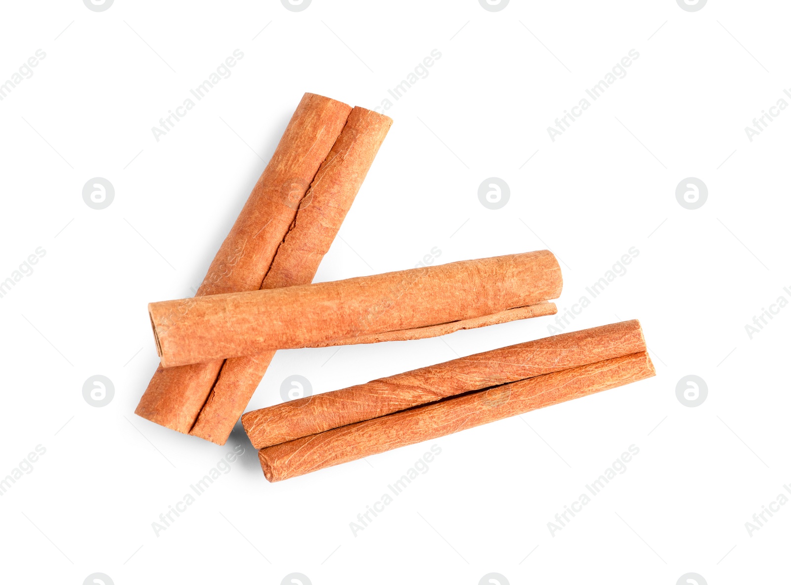 Photo of Cinnamon sticks isolated on white, top view