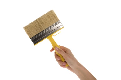 Photo of Woman holding paint brush on white background, closeup