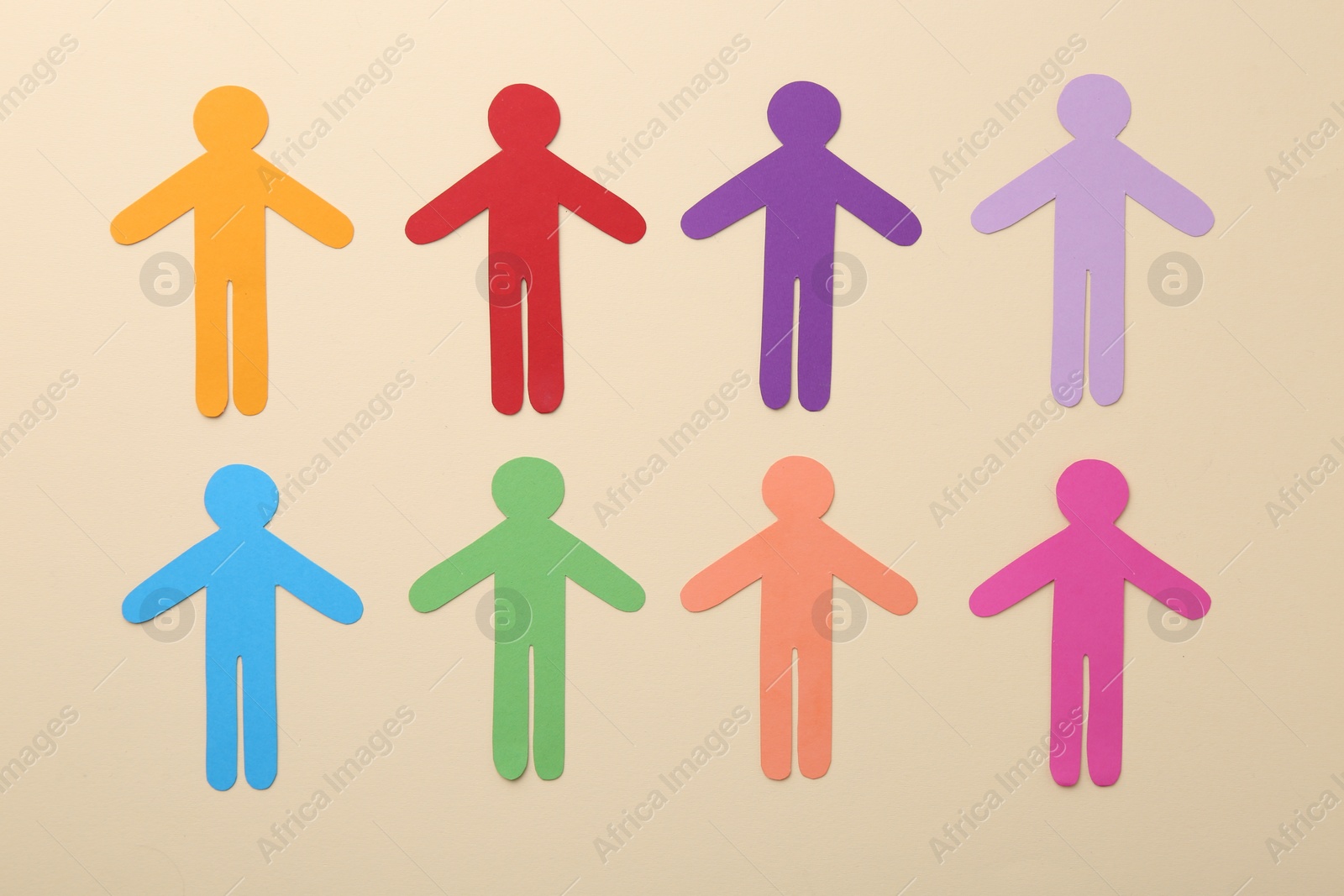 Photo of Equality concept. Different human figures on beige background, flat lay