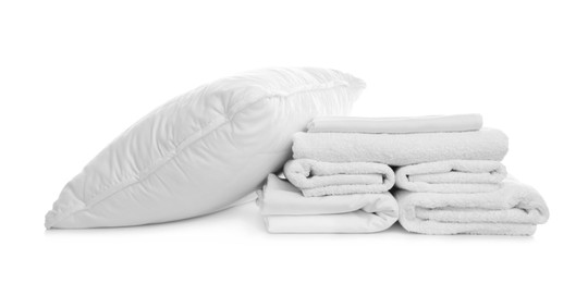 Photo of Pillow, bedding and towels on white background