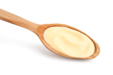 Wooden spoon with delicious cheese sauce isolated on white