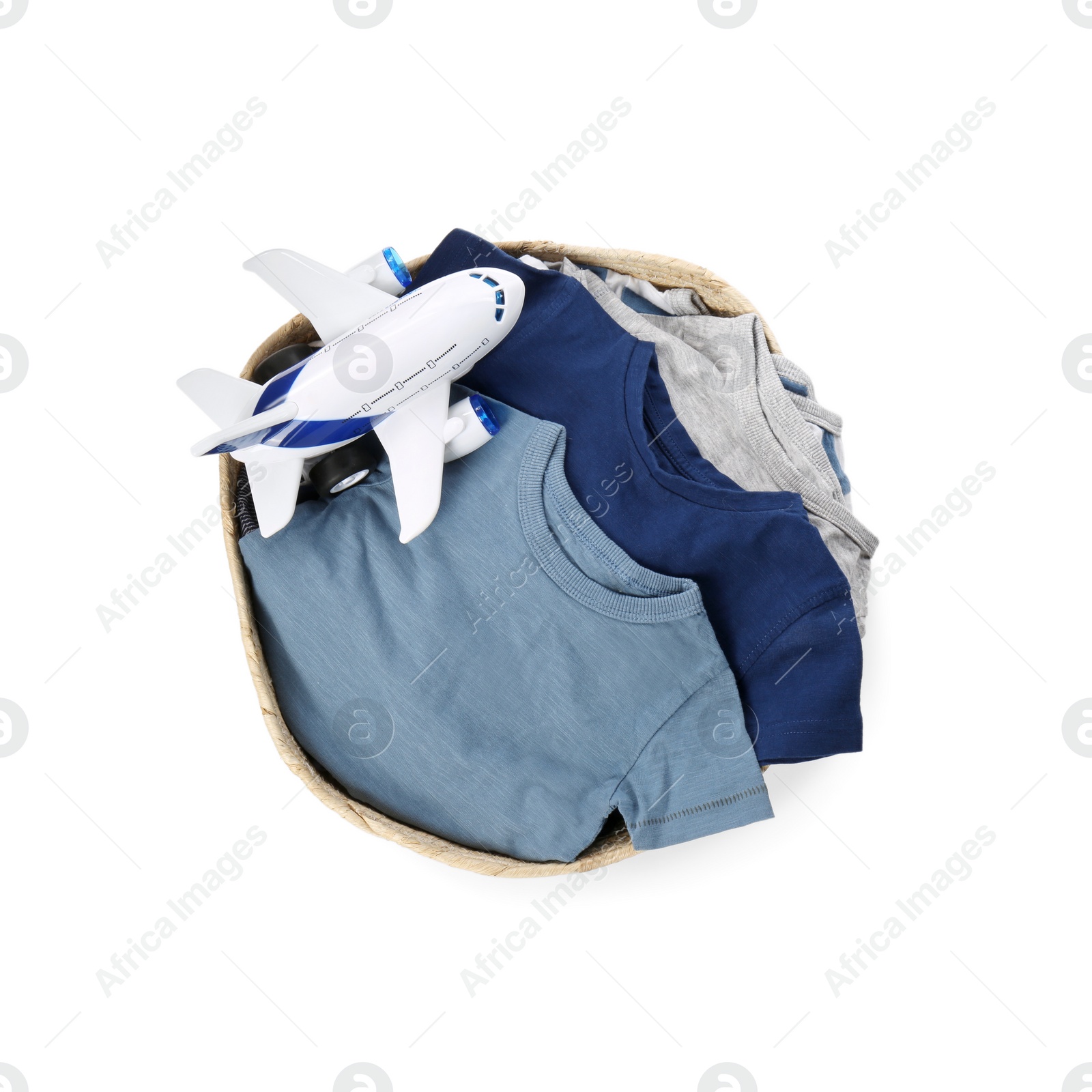 Photo of Laundry basket with baby clothes and toy isolated on white, top view