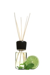 Aromatic reed air freshener and lime on white background