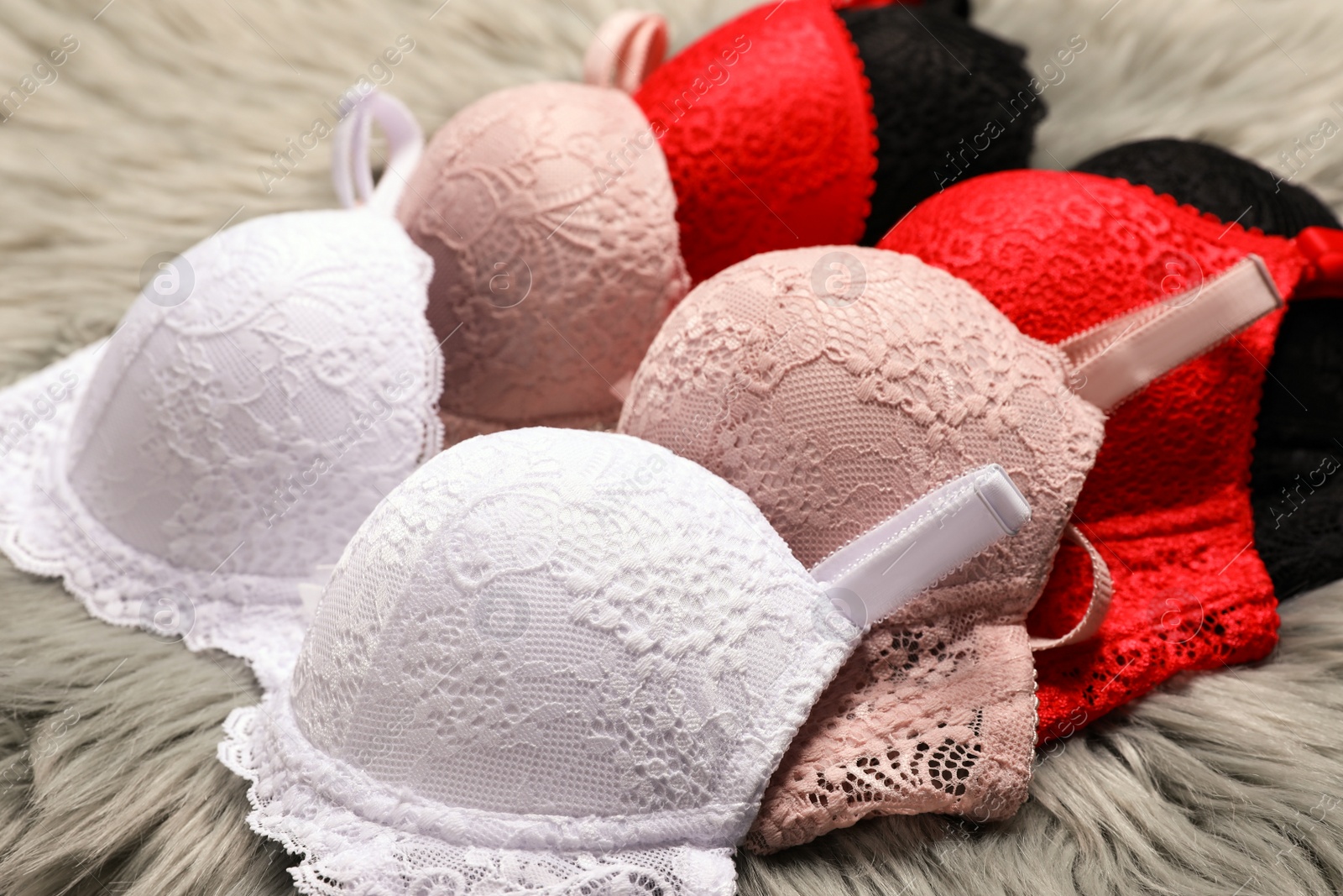 Photo of Beautiful lace bras on faux fur. Stylish underwear