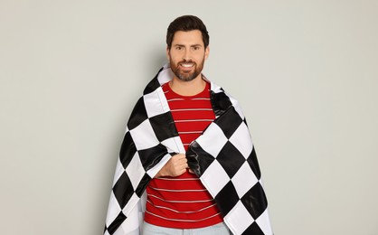 Man with checkered flag on white background