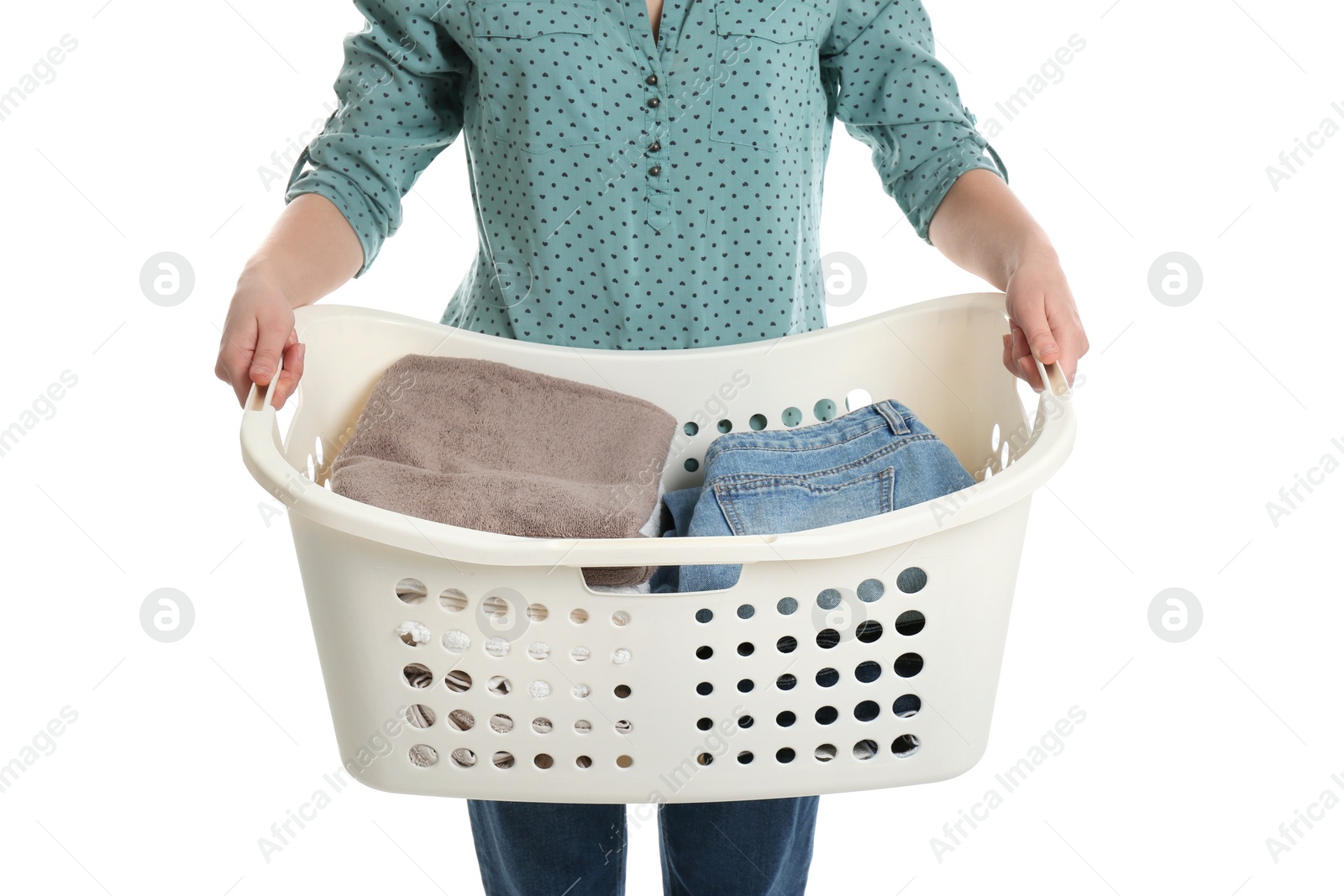 Photo of Young woman holding laundry basket with clothes on white background, closeup