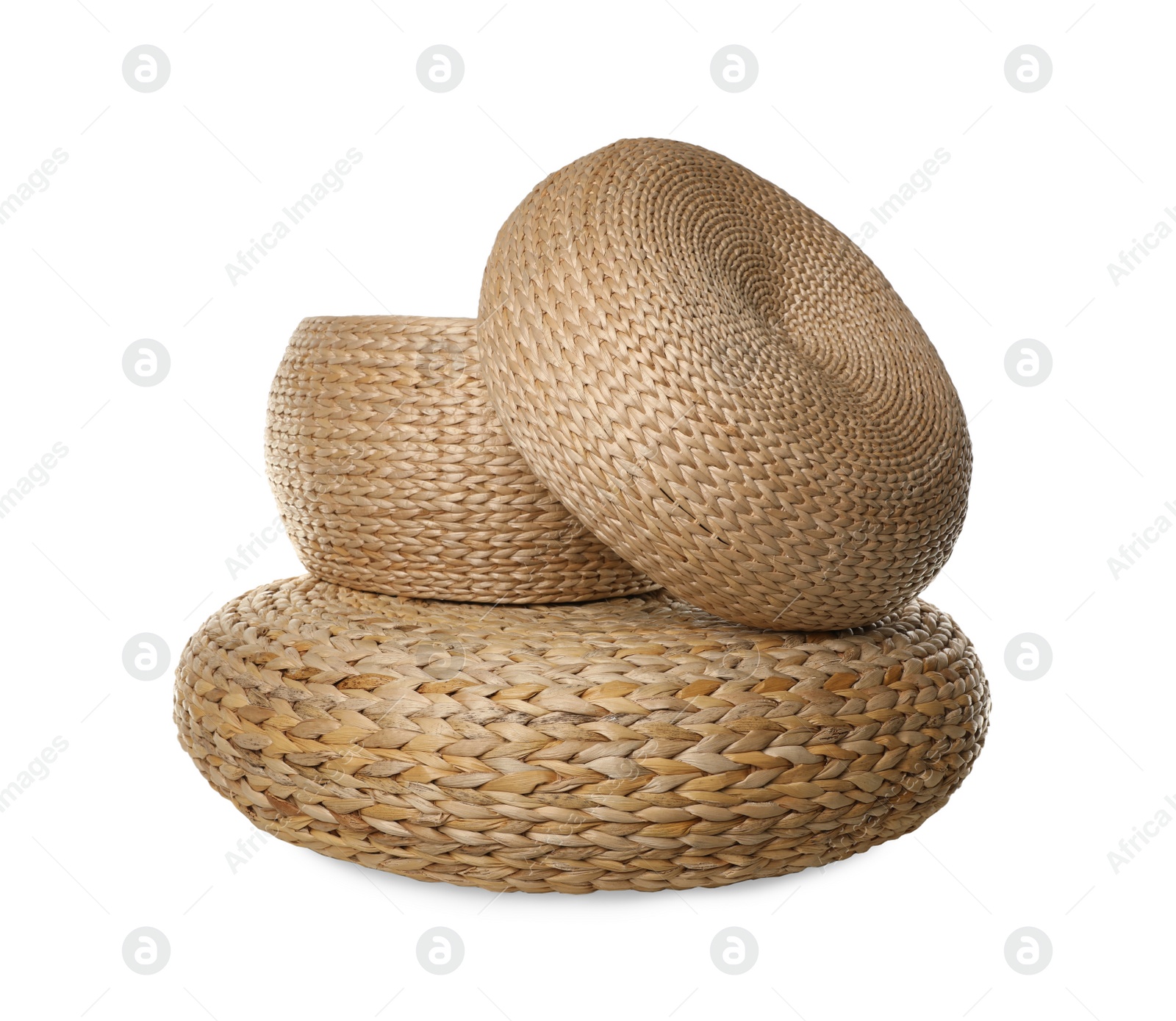 Photo of Three stylish wicker poufs on white background