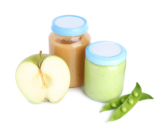 Jars with baby food, fresh pod with peas and apple on white background