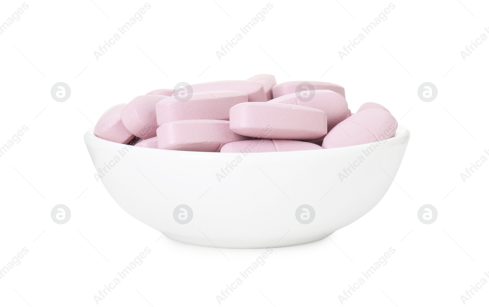 Photo of Vitamin pills in bowl isolated on white. Health supplement