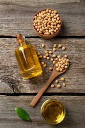 Photo of Flat lay composition with soybean oil on wooden table