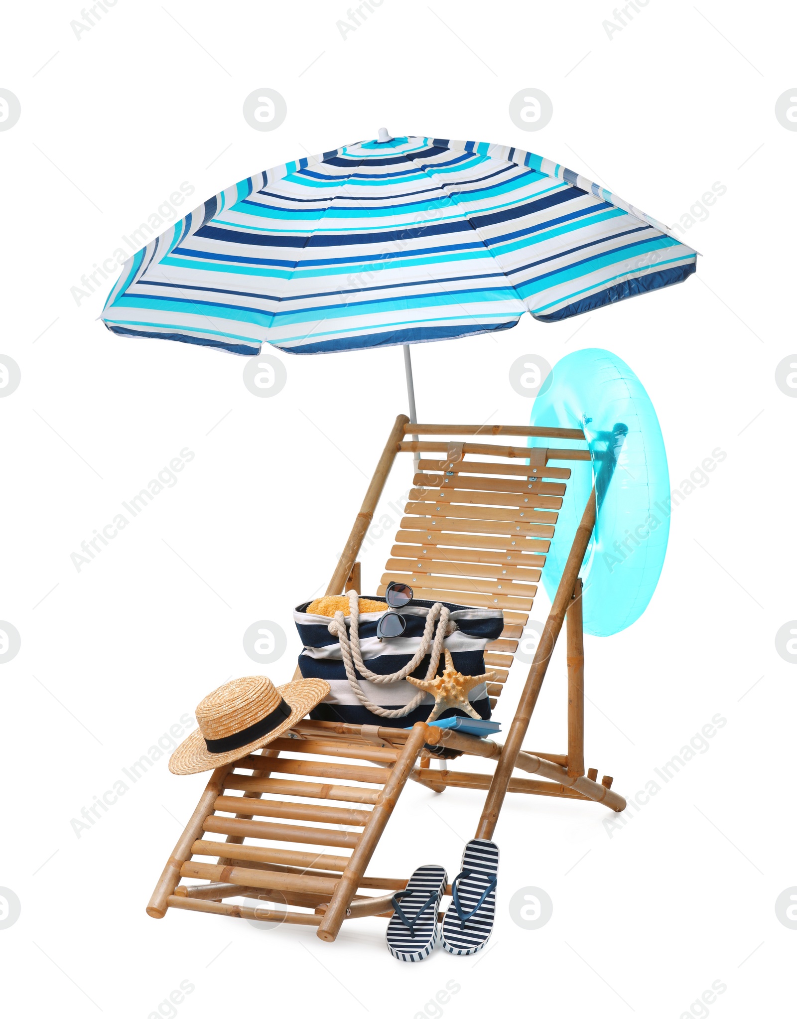 Photo of Deck chair, umbrella and other beach accessories isolated on white