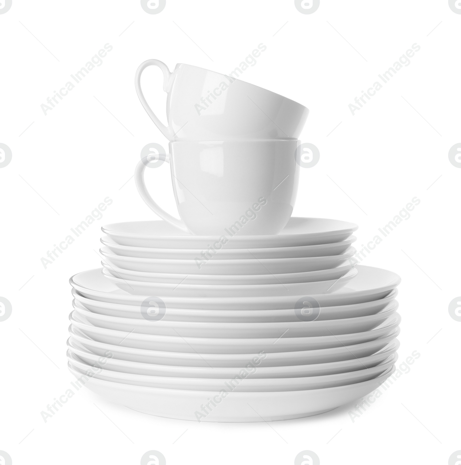 Photo of Set of clean tableware isolated on white