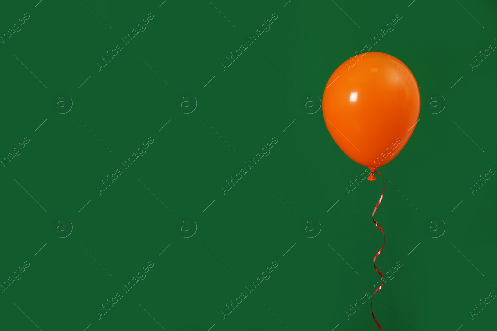 Photo of Bright balloon on color background, space for text. Celebration time