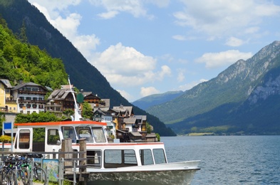 Picturesque view of small resort town near mountains on riverside