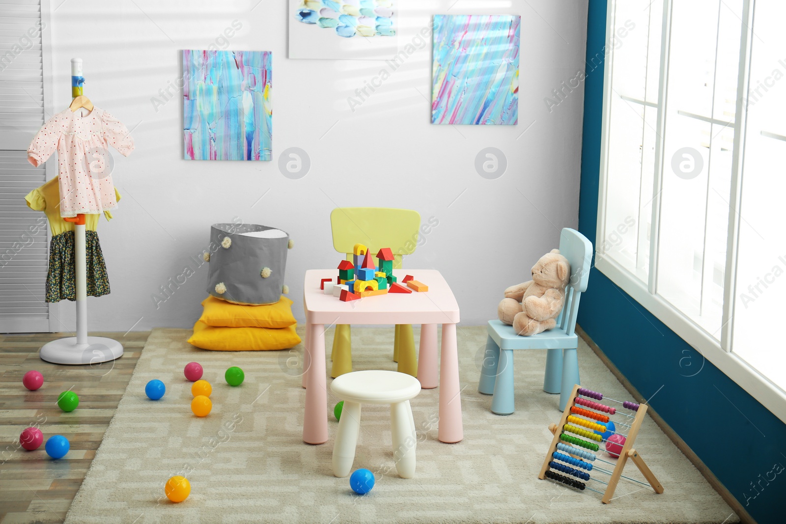 Photo of Baby room interior with color furniture and toys