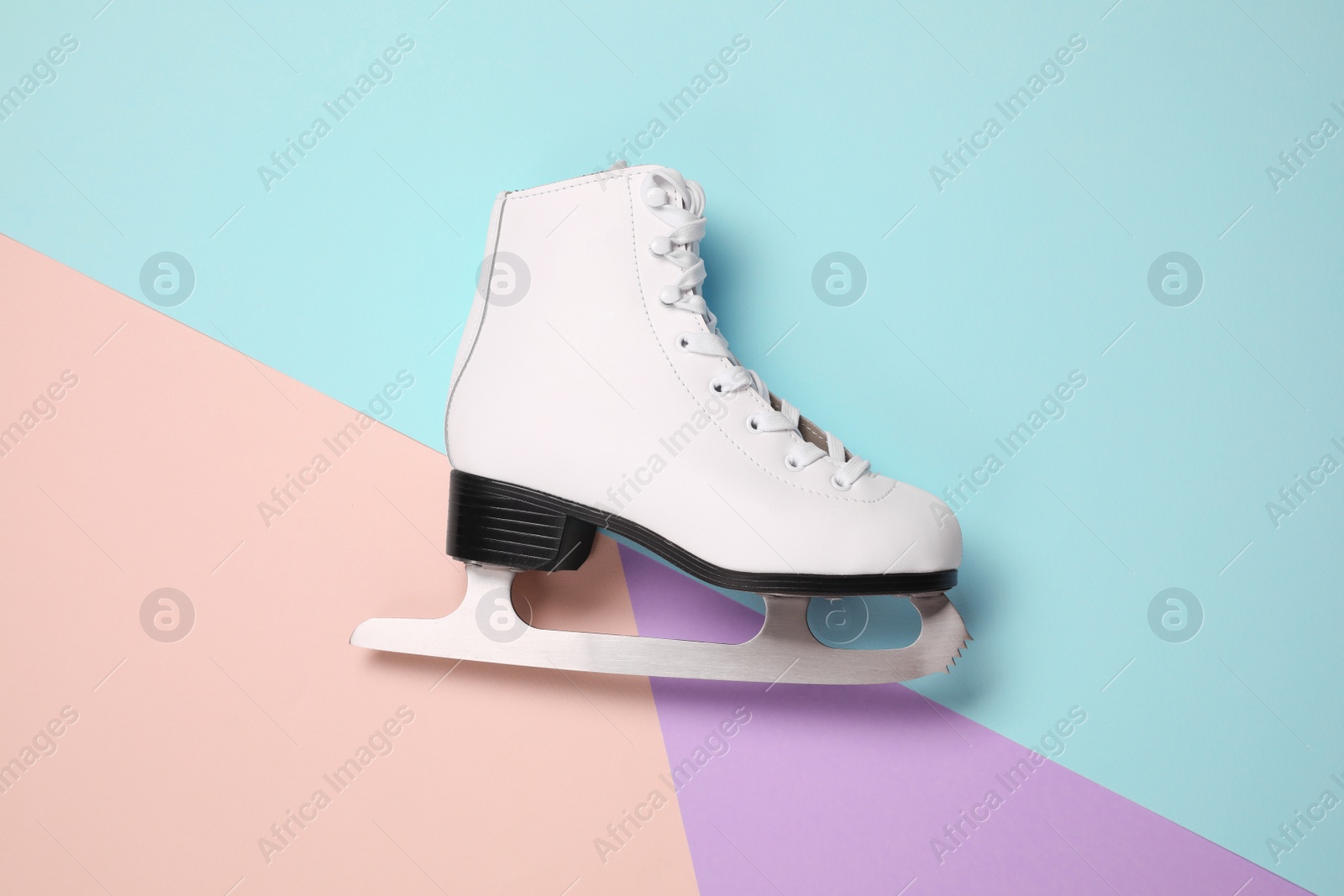 Photo of One skate on color background, top view