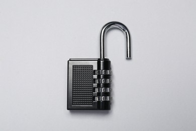 One steel combination padlock on grey background, top view