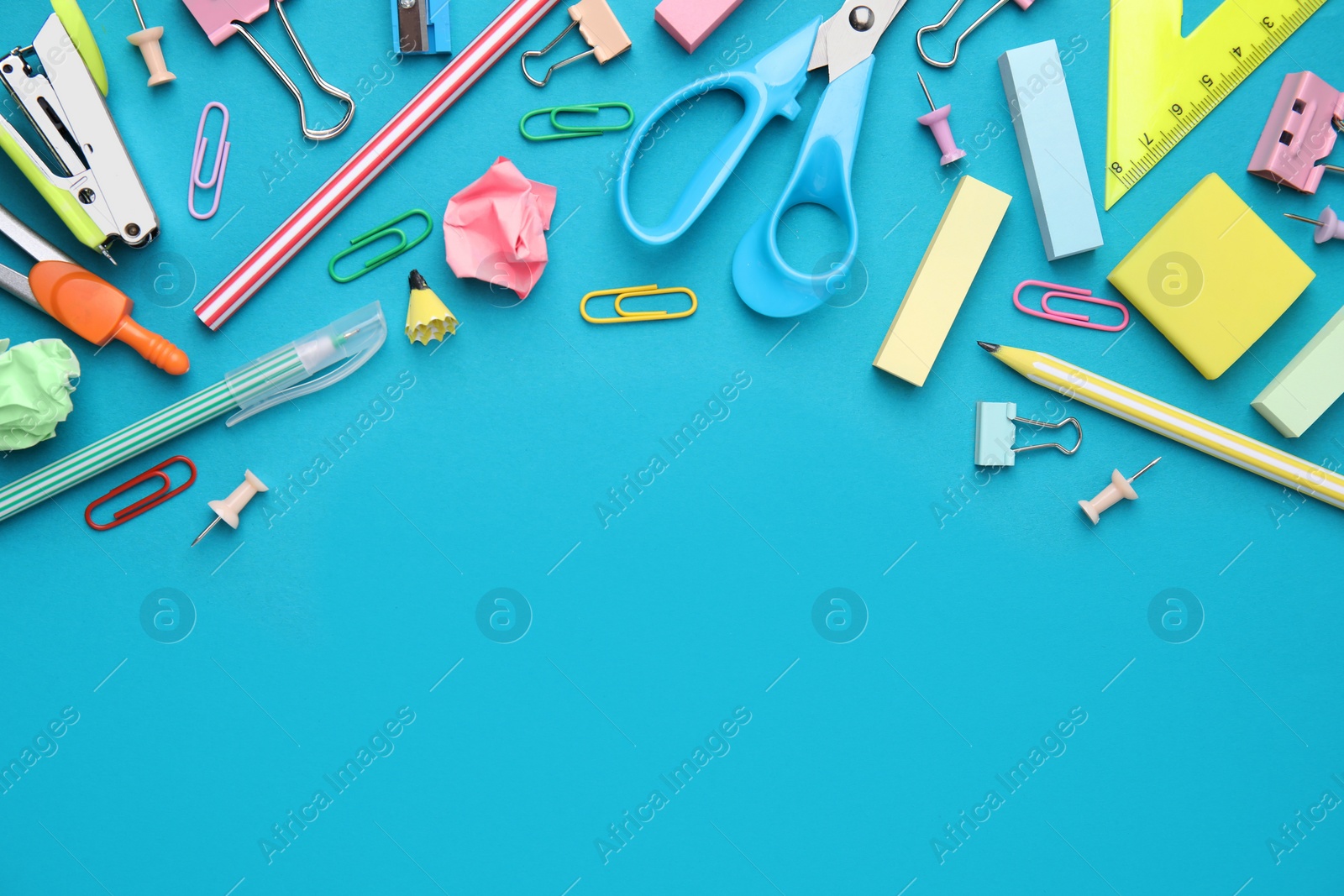 Photo of Different school stationery items on light blue background, flat lay with space for text. Back to school