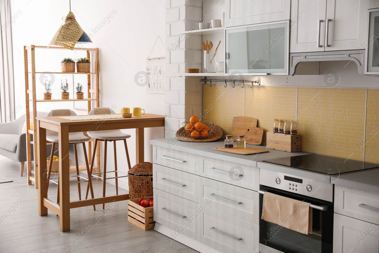 Photo of Modern kitchen interior with stylish wooden table