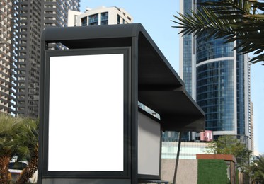 Image of Bus stop with empty signboard in city. Mock-up for design