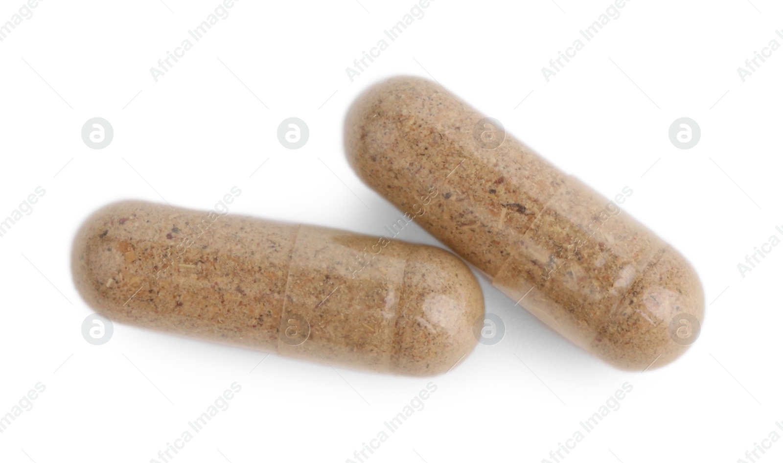 Photo of Two vitamin capsules isolated on white, top view