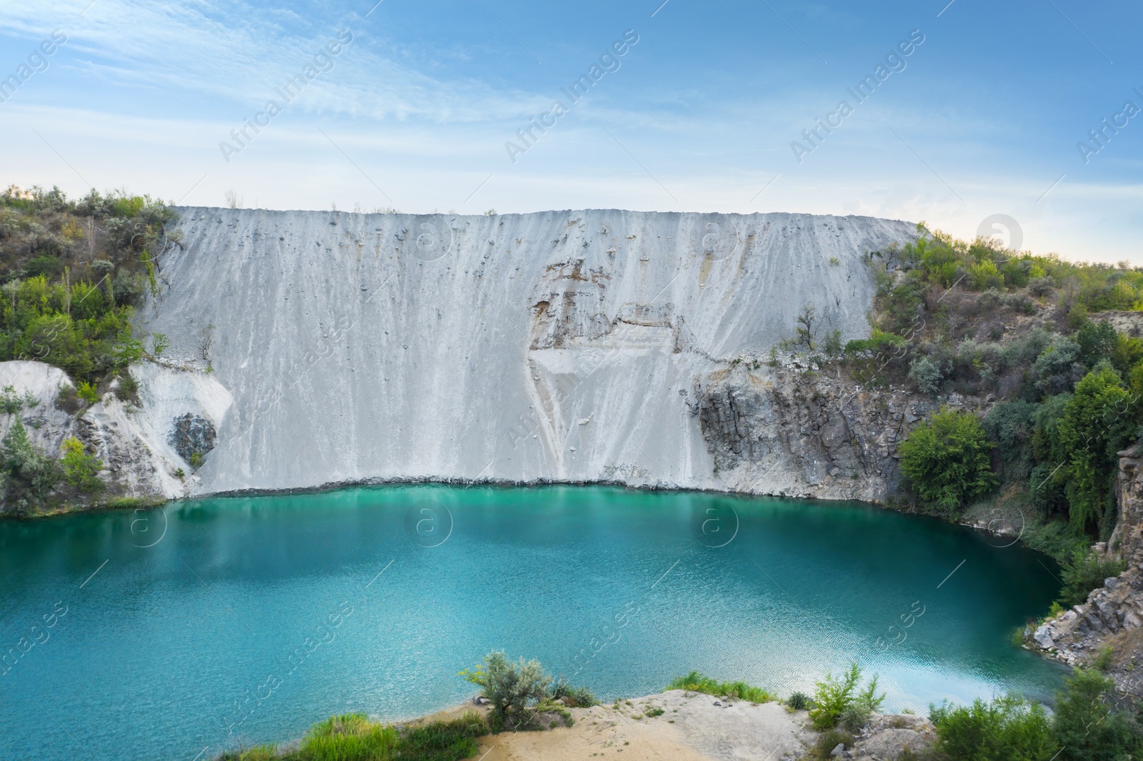 Image of Picturesque aerial view on turquoise lake with granite banks