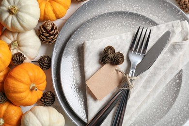 Photo of Thanksgiving day. Beautiful table setting and autumn decoration, flat lay