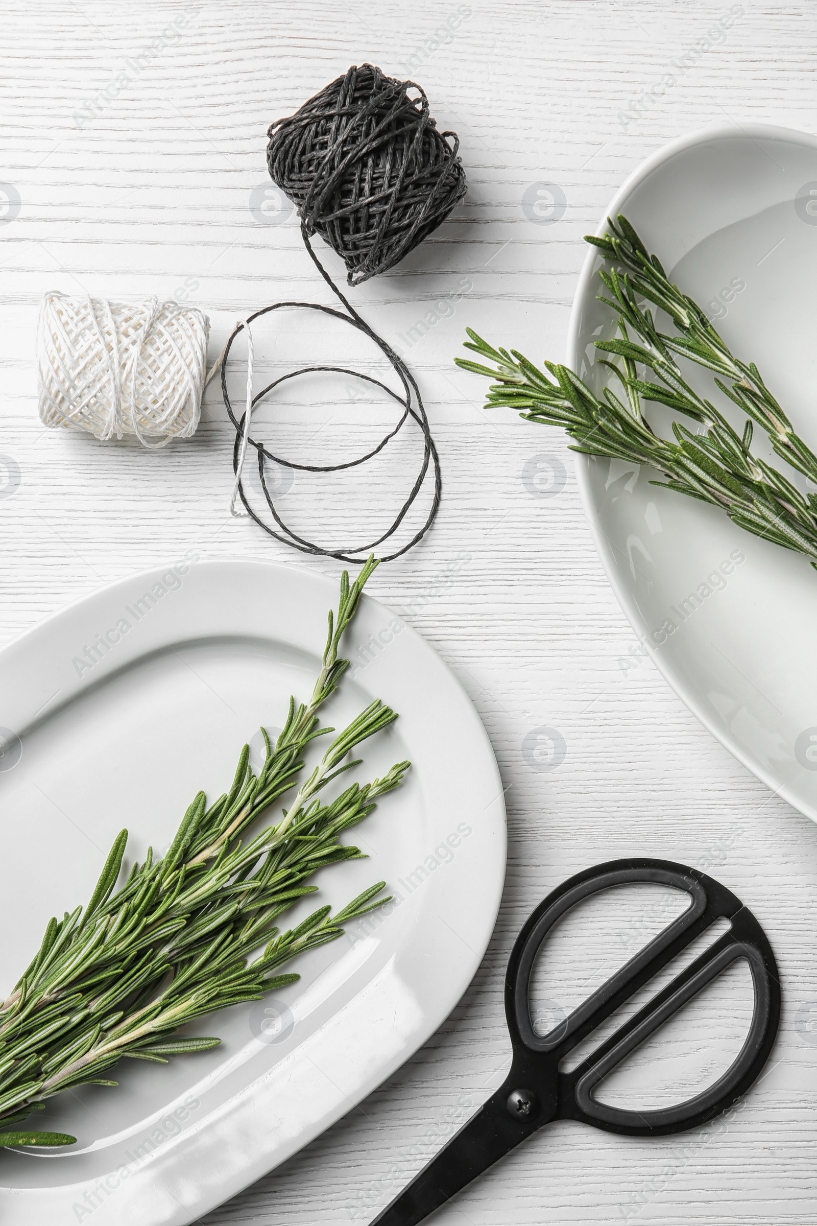 Photo of Flat lay composition with rosemary on table. Aromatic herbs