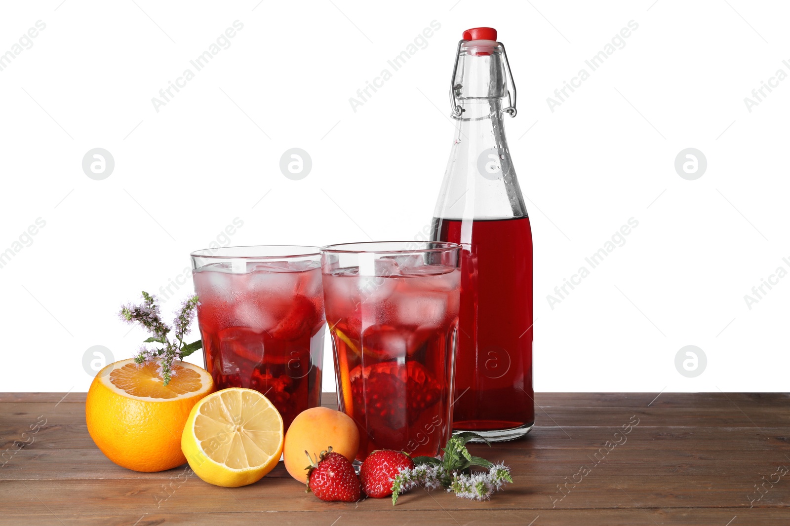 Photo of Delicious refreshing sangria, fruits and berries on wooden table against white background