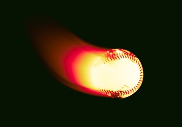 Image of Burning baseball ball flying at high speed on black background