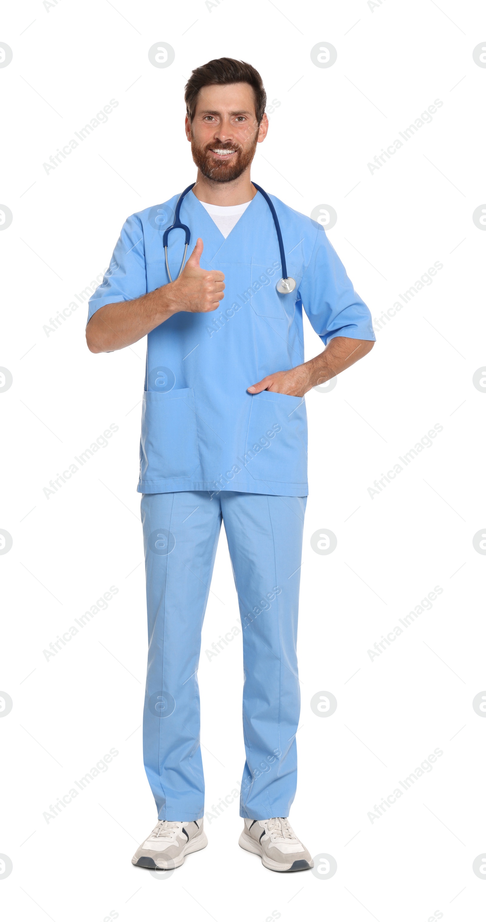 Photo of Full length portrait of doctor in scrubs on white background