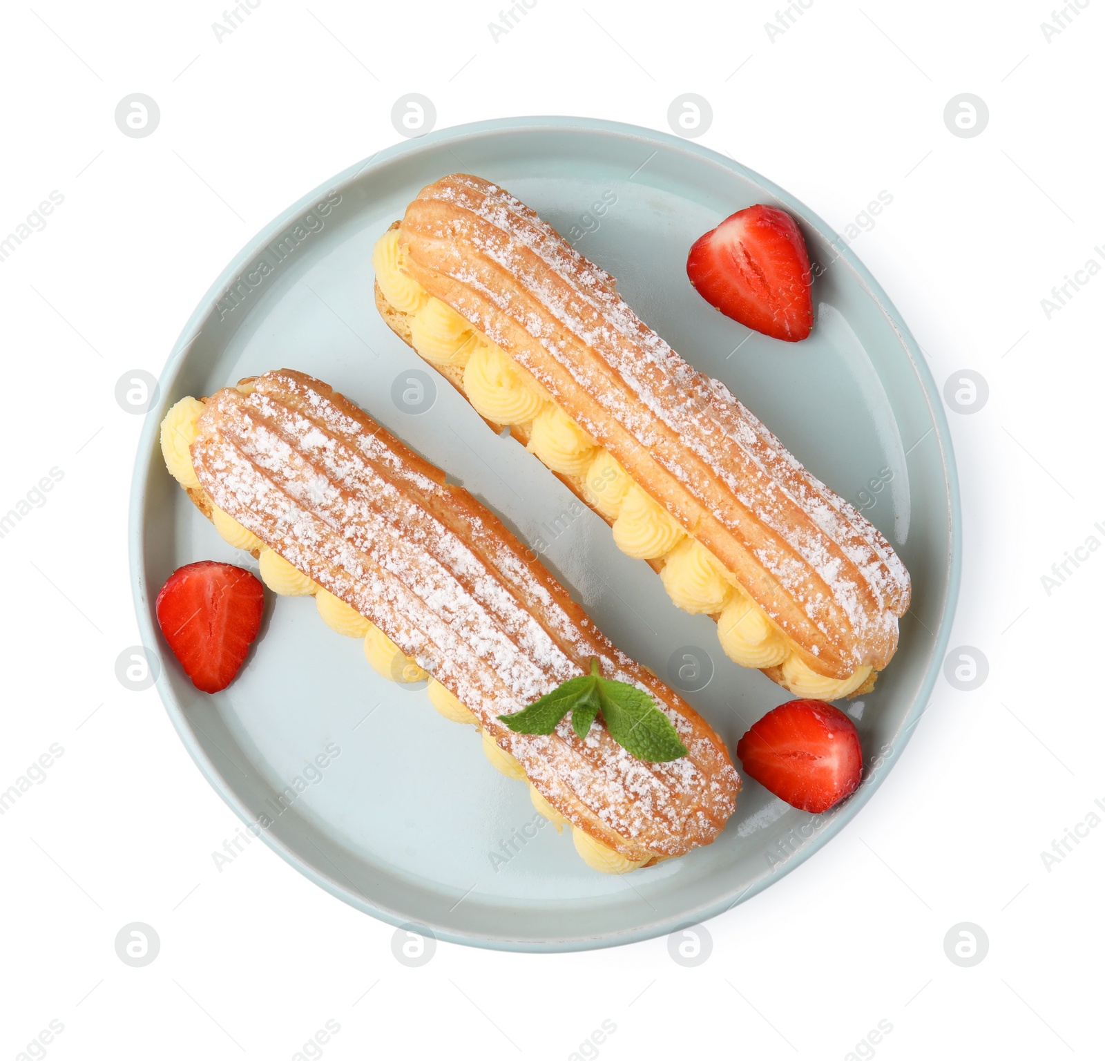 Photo of Delicious eclairs filled with cream, strawberries and mint isolated on white, top view