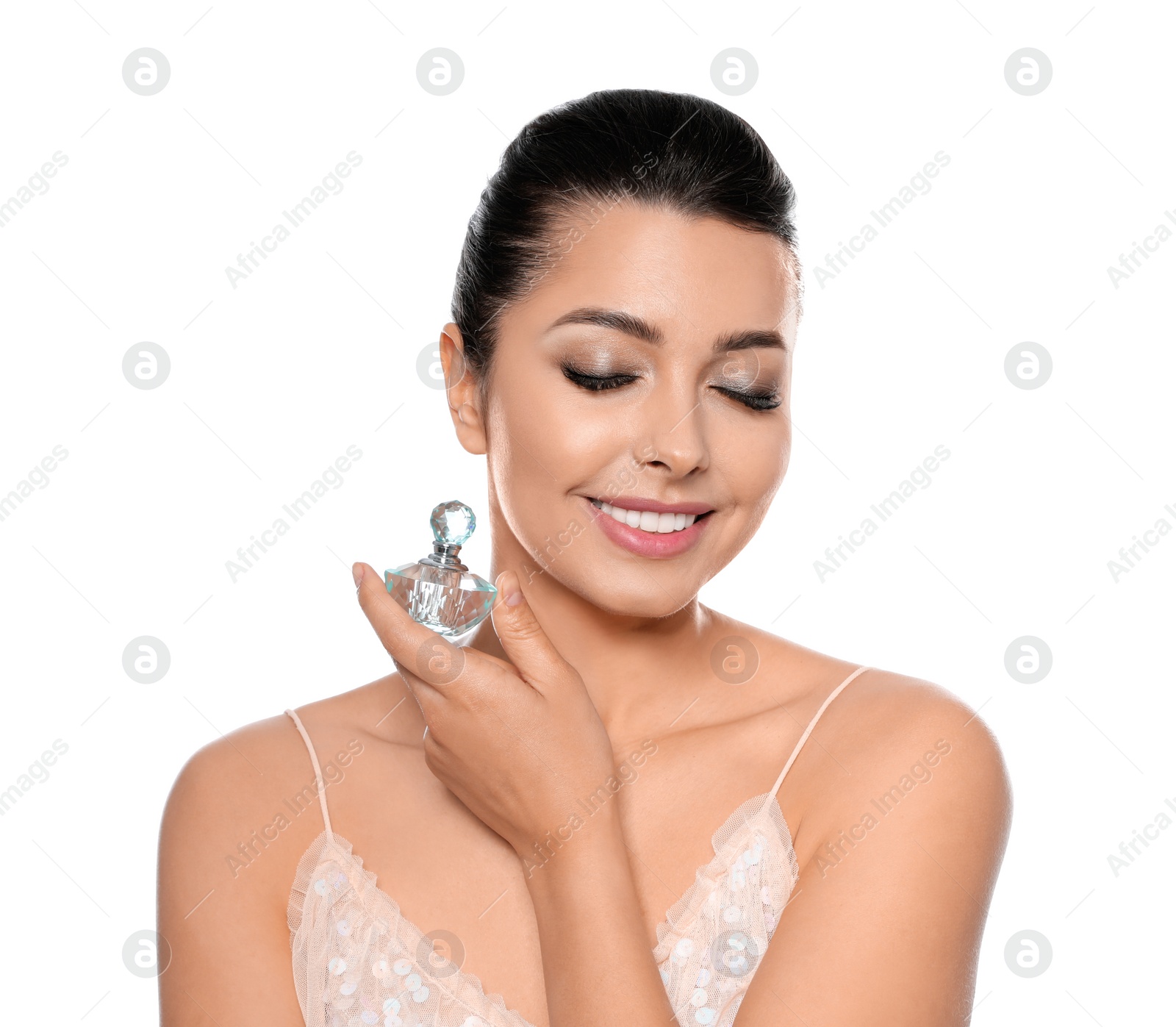 Photo of Young woman with bottle of perfume on white background