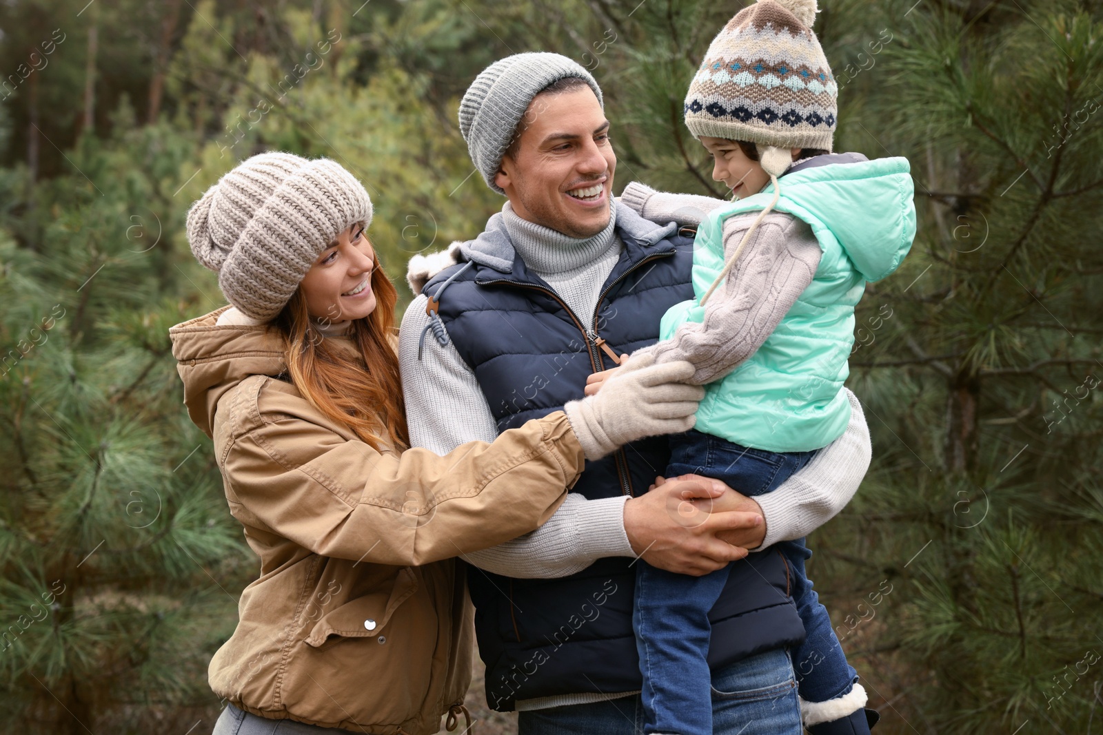 Photo of Happy family spending time together in forest