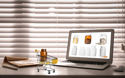 Ordering medications online. Modern laptop on table indoors