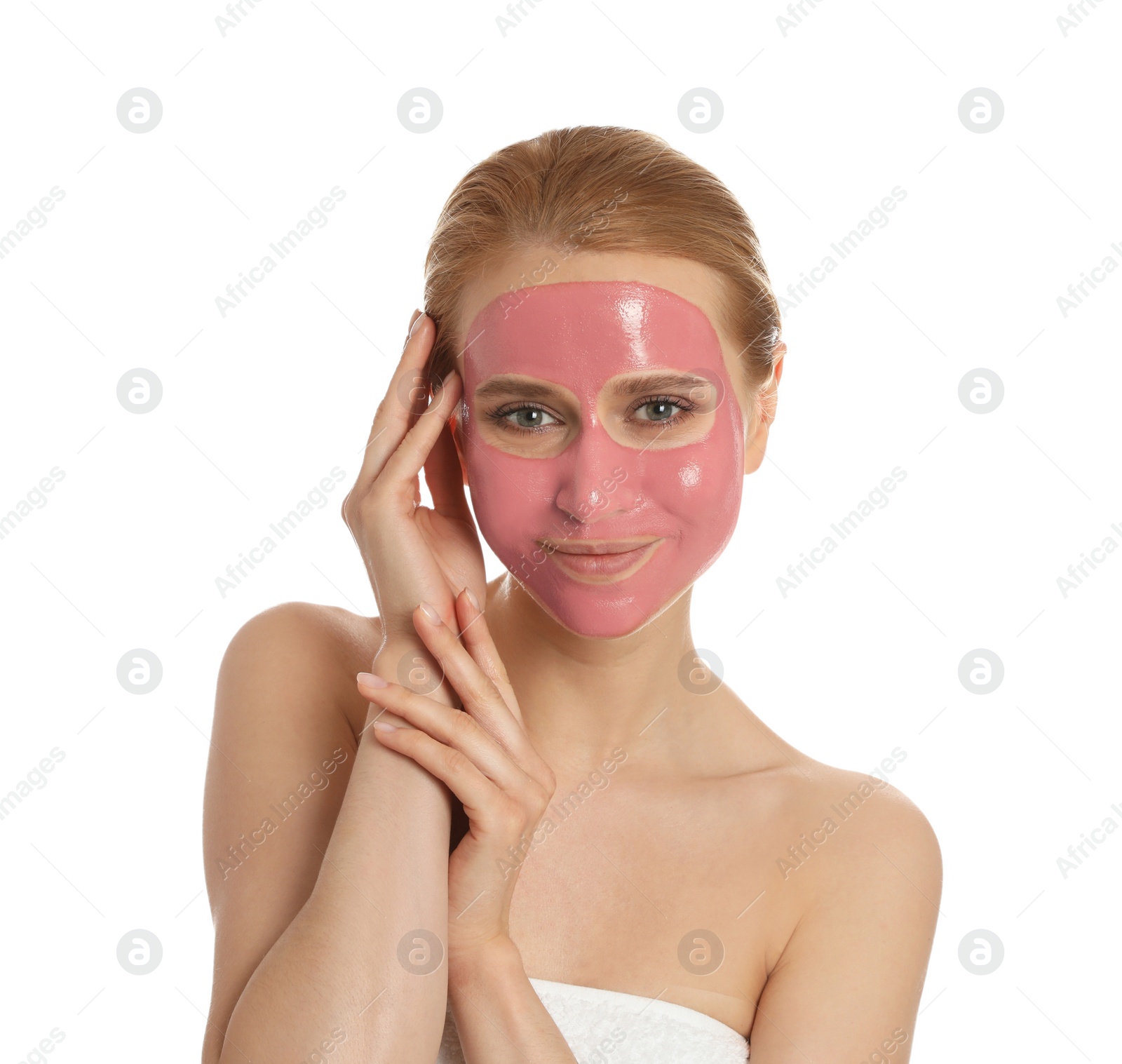 Photo of Young woman with pomegranate face mask on white background