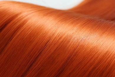 Photo of Beautiful red hair, closeup view. Professional hairdresser