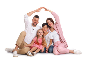 Photo of Happy family forming roof with their hands on white background. Insurance concept