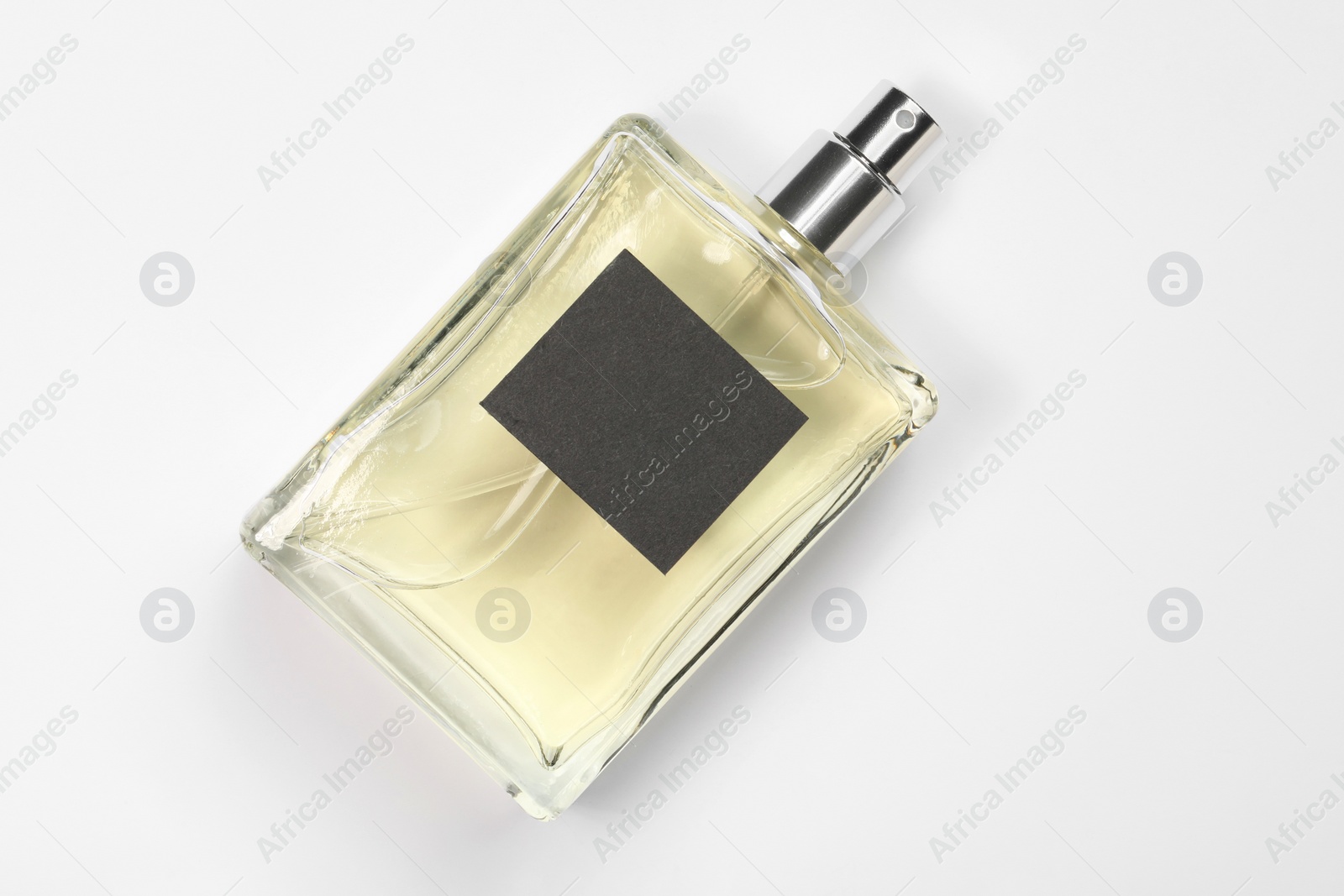 Photo of Luxury men's perfume in bottle on white background, top view