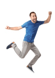 Full length portrait of happy handsome man jumping on white background