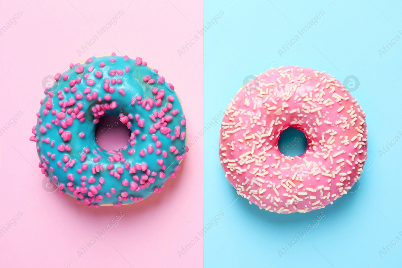 Photo of Delicious glazed doughnuts on color background, top view