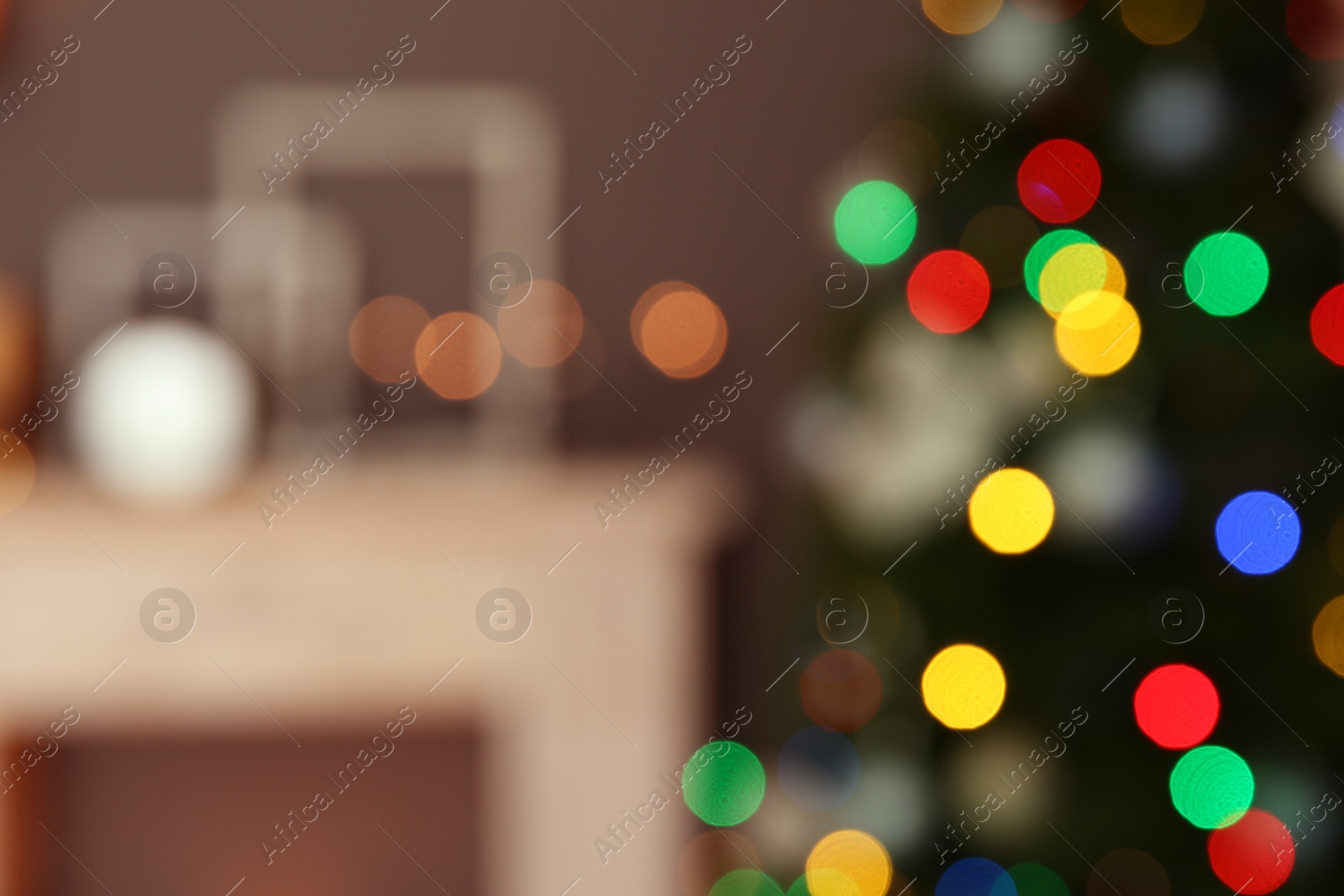 Photo of Blurred view of room interior with decorated Christmas tree